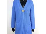 the sweater is blue and has a gold broochet on it