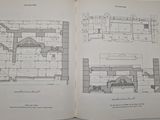 an open book with a drawing of a building and a drawing of a kitchen
