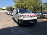 a white van that is parked on the side of the road