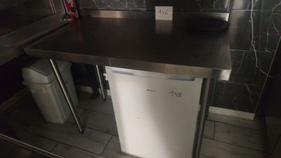 an image of a kitchen with a refrigerator and a sink