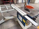 a picture of a machine that is cutting a piece of wood