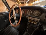 the interior of an old car with a steering wheel and dashboard