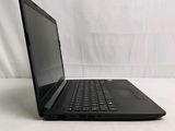 a black laptop computer sitting on a white surface
