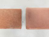 two pieces of cloth sitting next to each other on a white surface