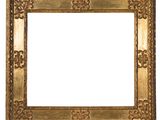 an old gold frame with a decorative pattern on a white background
