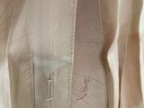 a close up of a shirt with a zipper on it