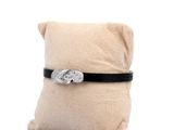 a pillow with a ring on it on a white background