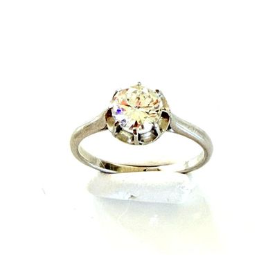 an image of a diamond ring on a white surface