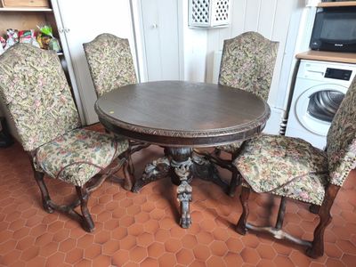 four chairs around a table in the kitchen