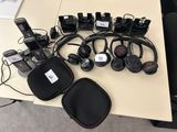 many headphones that are sitting on a table