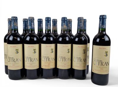 six bottles of red wine are lined up in a row