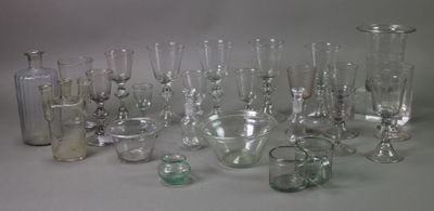 a lot of glass vases that are sitting on a table