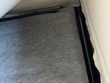 a black zipper on the bottom of a white couch