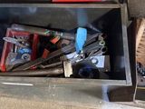 a tool box with tools in it sitting on the floor