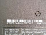 a close up of a laptop with a label on it
