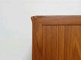 a wooden cabinet with a clock on top of it