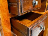 a wooden drawer with two drawers on top of it