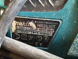 a close up of a blue machine with a number plate on it