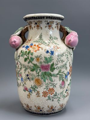 a vase with flowers on it sitting on a table