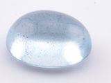 a close up of a blue glass object on a white surface