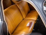 a brown leather seat in the back of a car