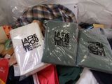 a pile of clothing that is sitting on the floor