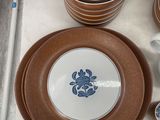 many plates and cups on a tray on the table