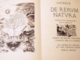 an open book with a picture of a forest