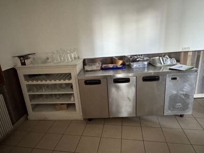 an image of a kitchen with a stainless steel counter top