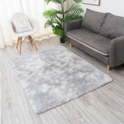 grey shaggy rug in a living room with a couch and a chair