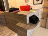 a desk with a purse on it in a room