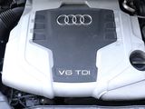 a close up of a car engine with its hood open