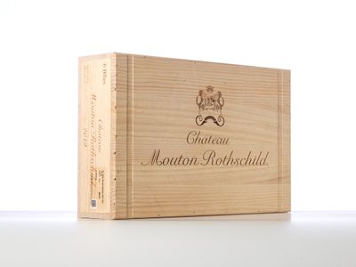 a close up of a wooden box with a bottle of wine in it