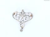 an image of a diamond heart broochle on a white background