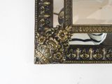 a picture of a mirror hanging on the wall