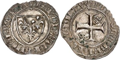a silver coin with a cross on the front and a shield on the back