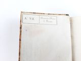 someone is holding a book open to a page with a picture on it