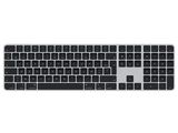 une image représentant un clavier d'ordinateur en noir et blanc posé sur une surface blanche