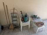 two chairs and a table on the floor in front of a wall