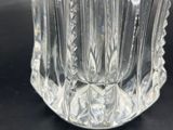 a glass vase that is sitting on a table