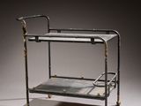 a metal and glass serving cart on a white surface