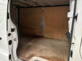 a white van with the door open in a garage