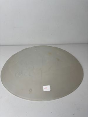 a white microwave with a glass cover on top of it