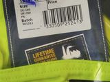 a label on the back of a yellow jacket