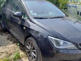 an image of a black car parked in front of a building
