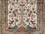 an image of a rug with a tree of life on it
