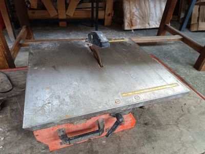 a table that has a piece of metal on top of it