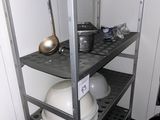 a metal shelving with a lot of dishes on it