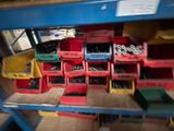 many bins of assorted tools on a shelf