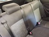 an image of a car with two seats facing each other